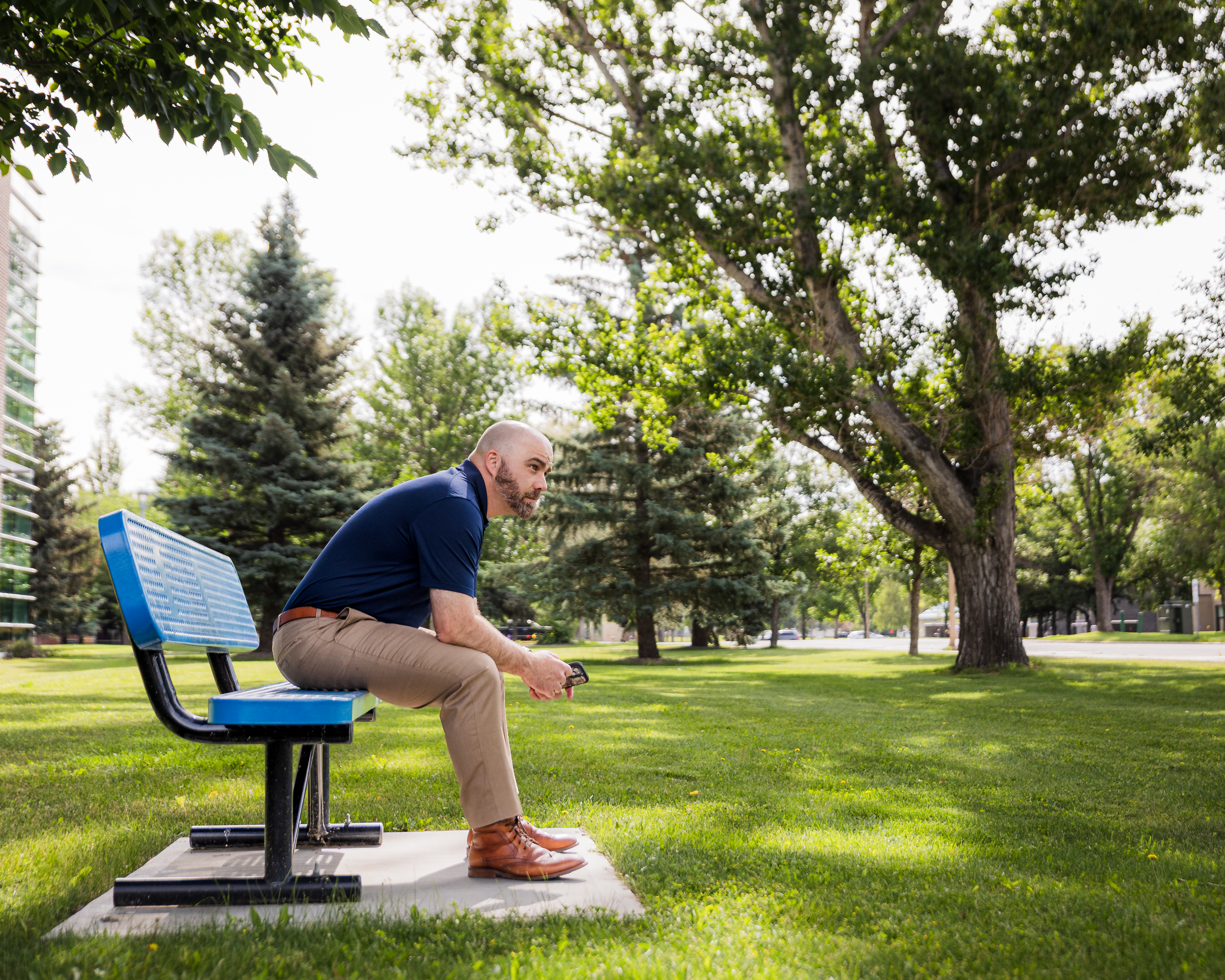 Man sitting on a bench in a park